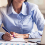 woman-writing-at-desk